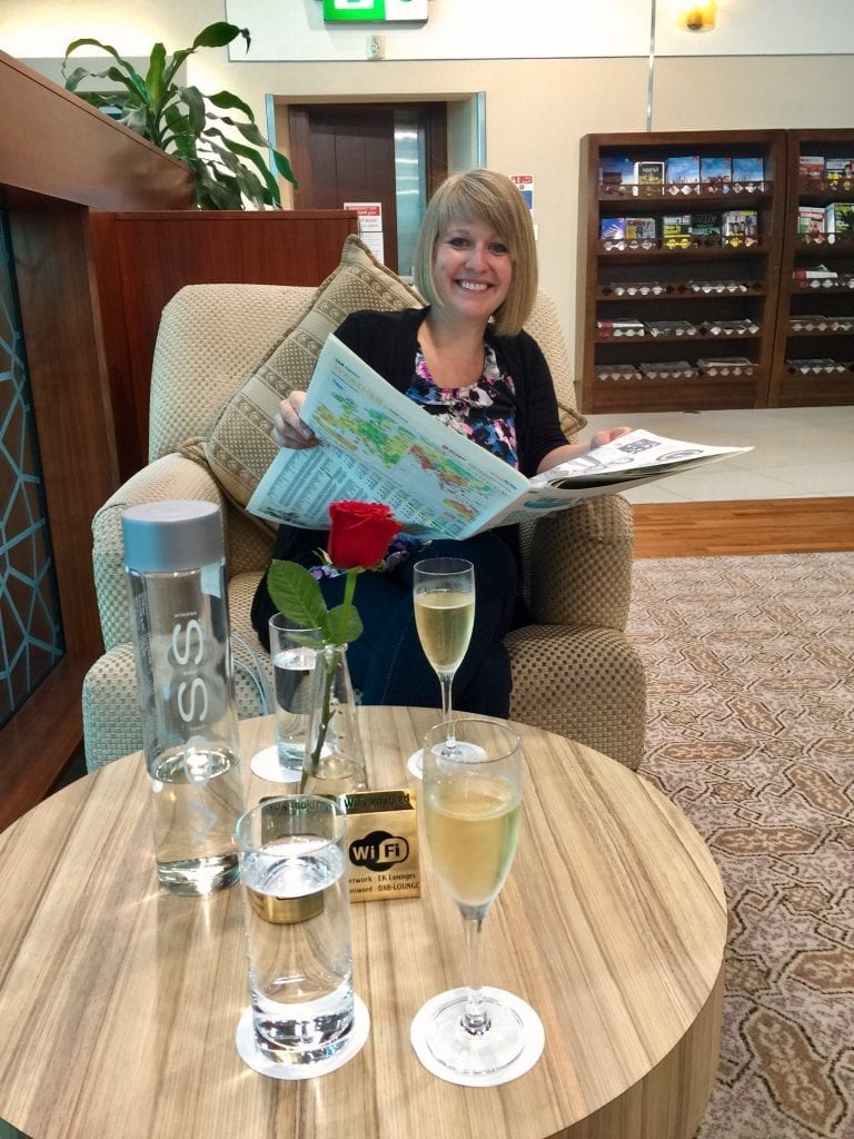 A person sitting at a table with wine glasses