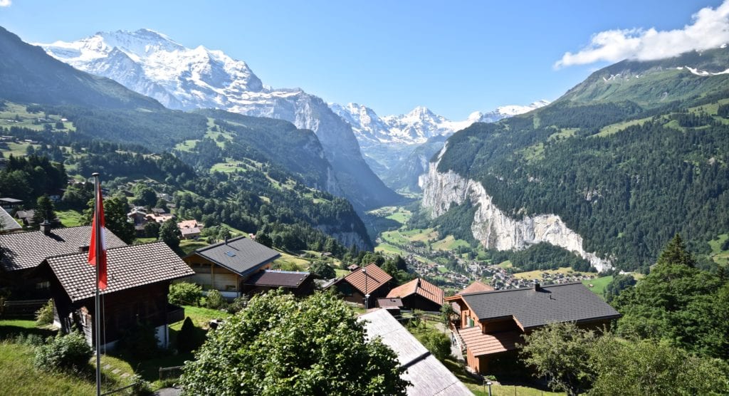 A view of a house with a mountain in the background