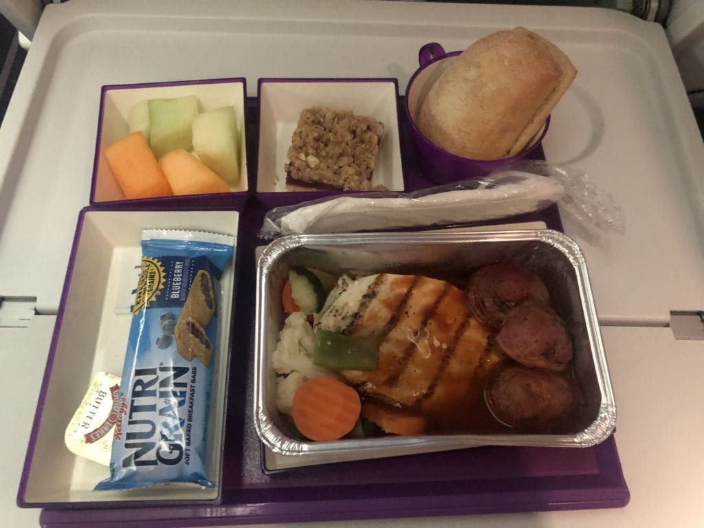 A box filled with different types of food on a tray