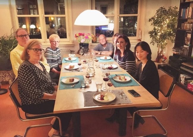 A group of people sitting at a table in a restaurant