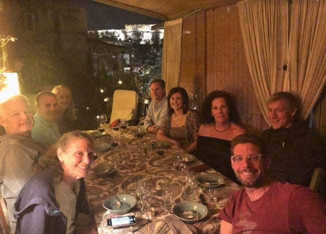 A group of people sitting at a dinner table