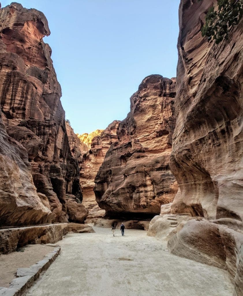 A canyon with a mountain in the background