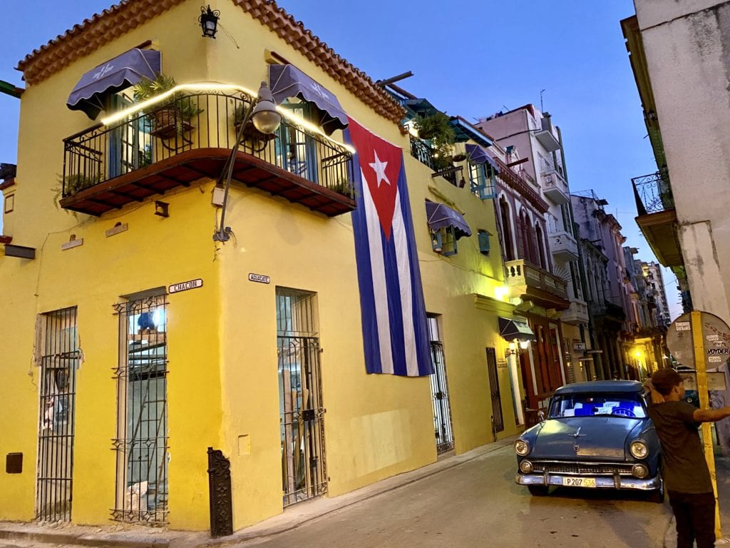 A car parked on the side of a building in Cuba