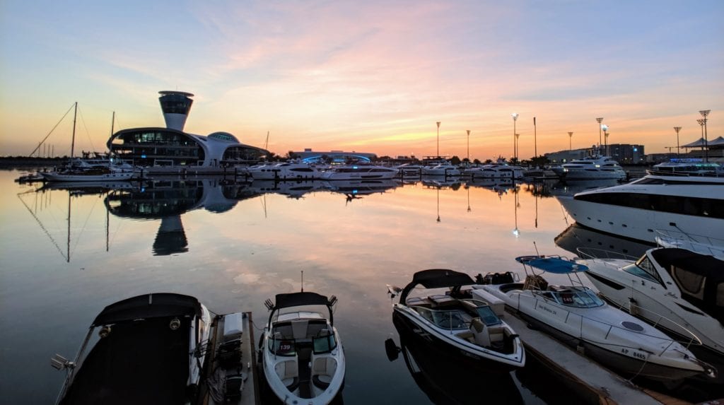 A boat is docked next to a body of water