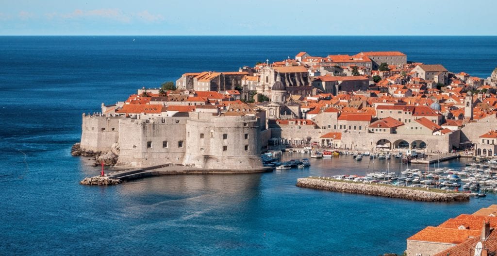 A large body of water with Dubrovnik in the background