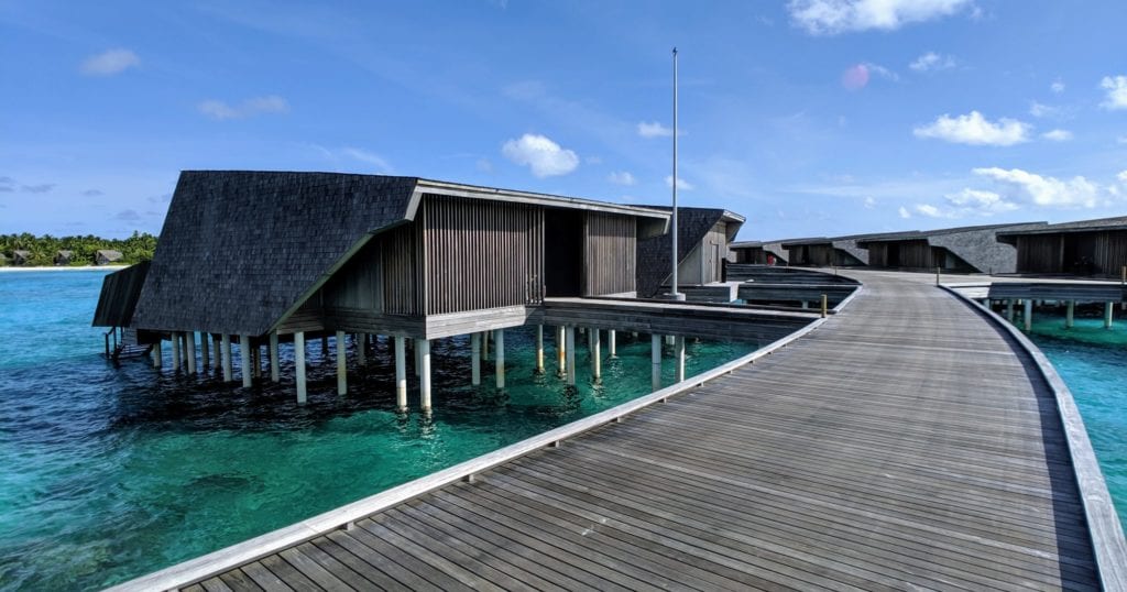 A wooden dock in front of a pool of water