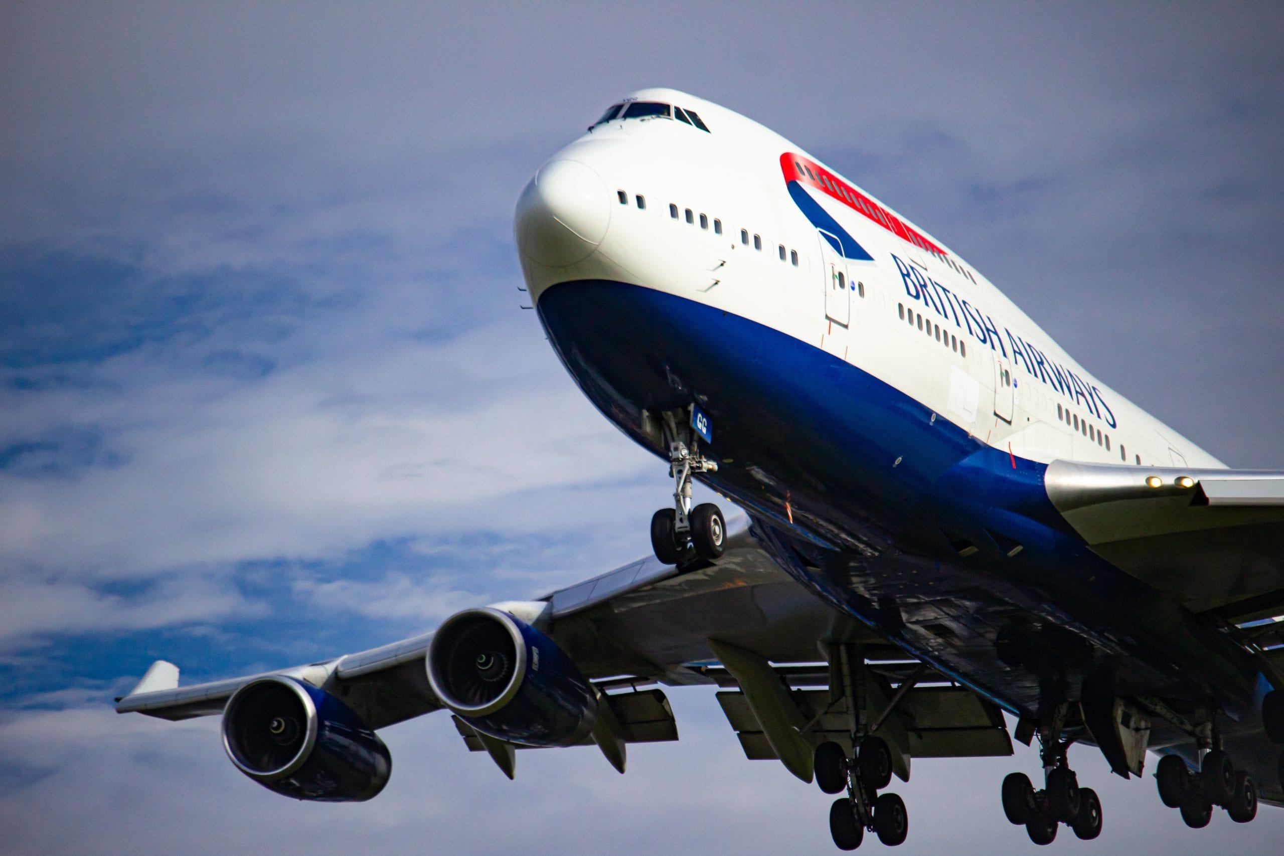 A large passenger jet flying through a blue sky