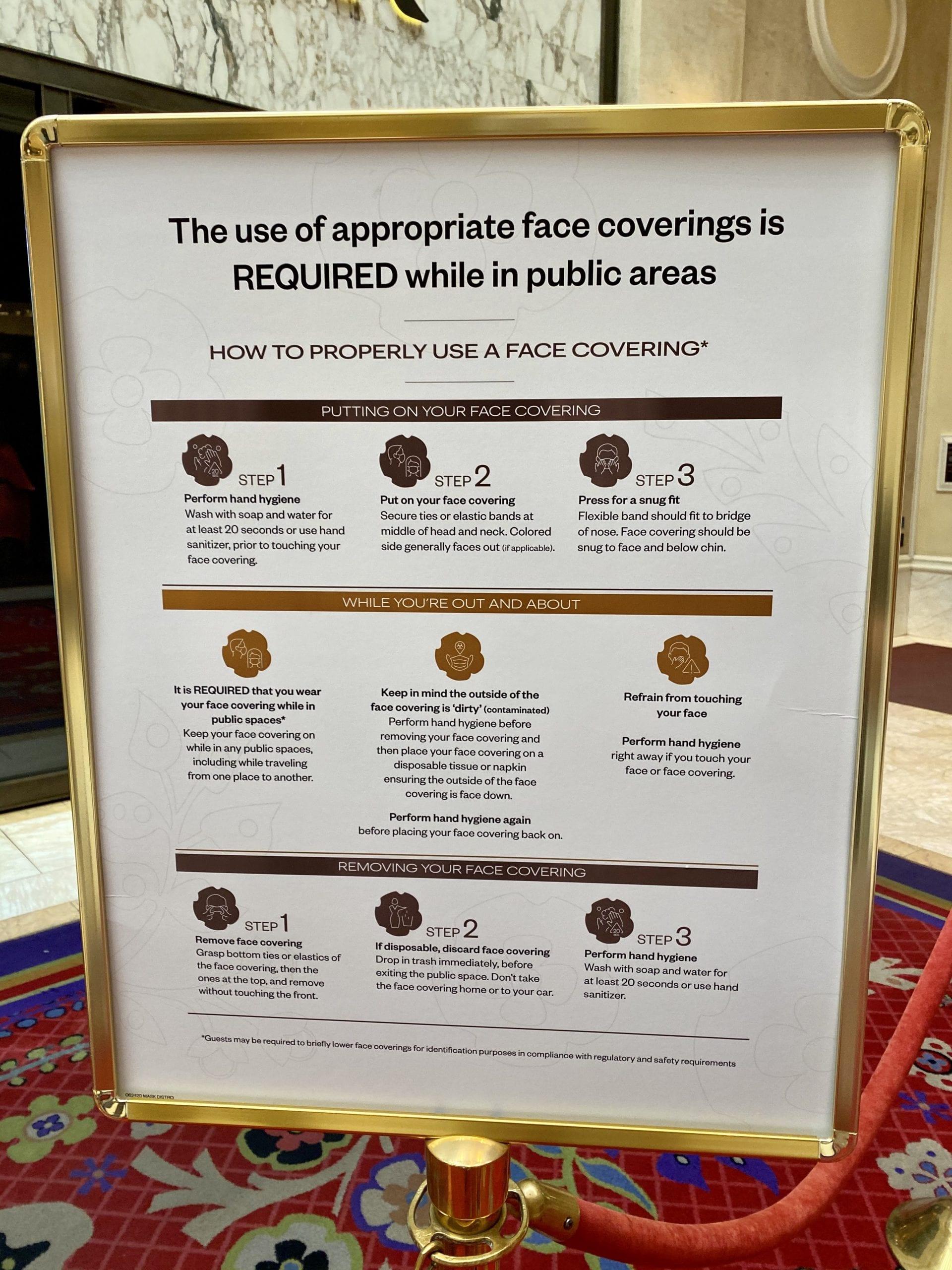 sign showing face covering policies