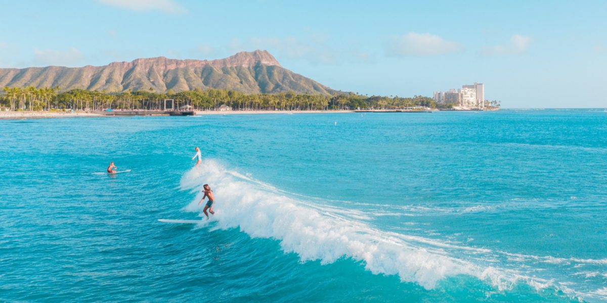 A man riding a wave on top of a body of water