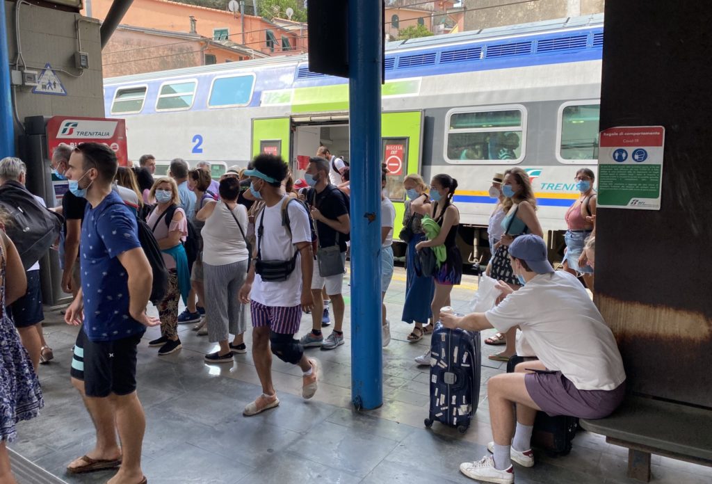 Passengers exiting train in Italy