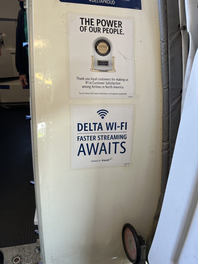 delta viasat wifi boarding door sign