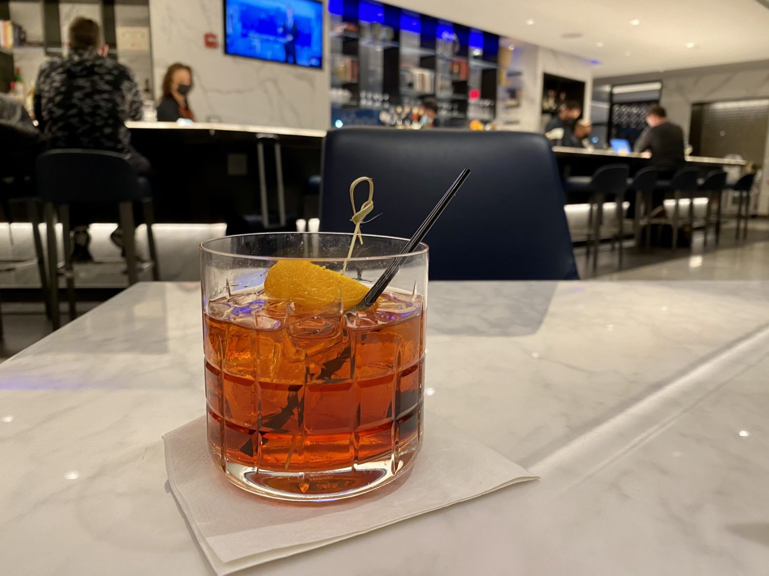 cocktail at the united polaris lounge newark
