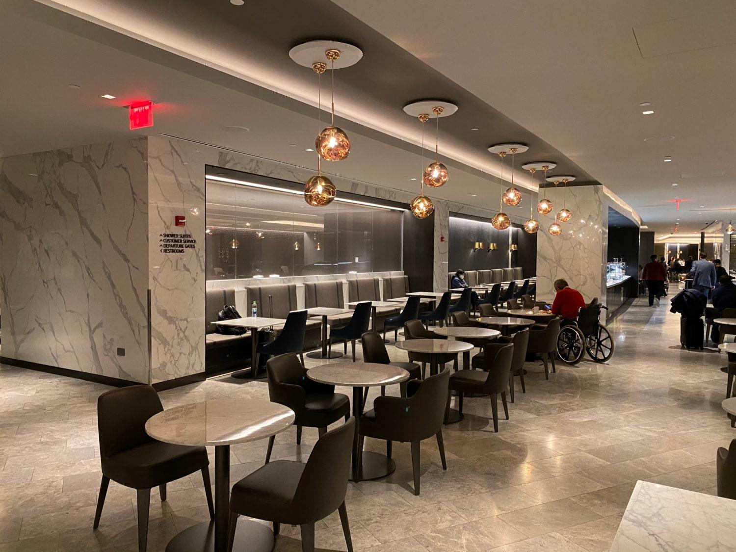 cafe seating and dining tables inside the polaris lounge in newark