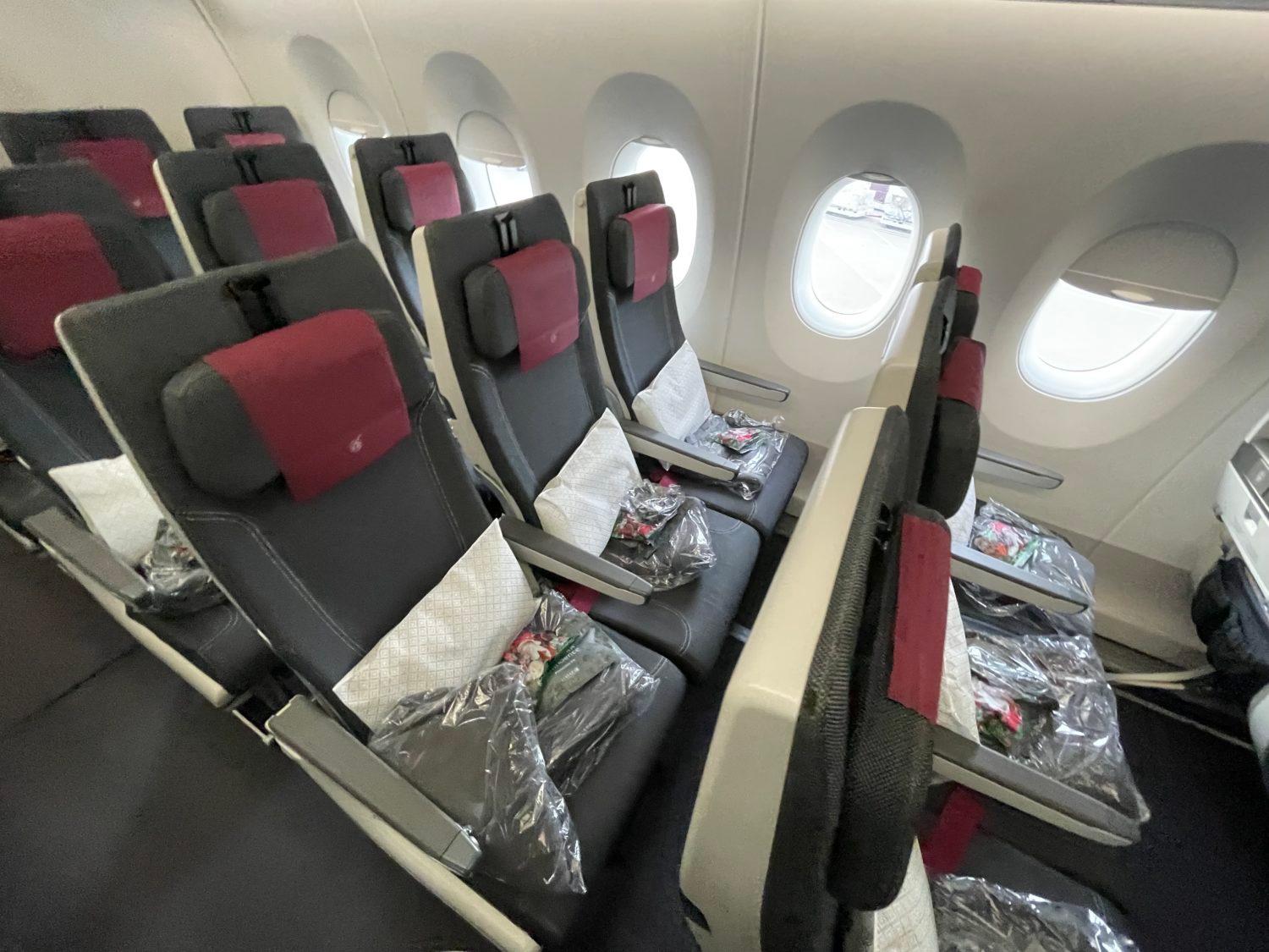 qatar airways economy seats with pillows and amenity kits