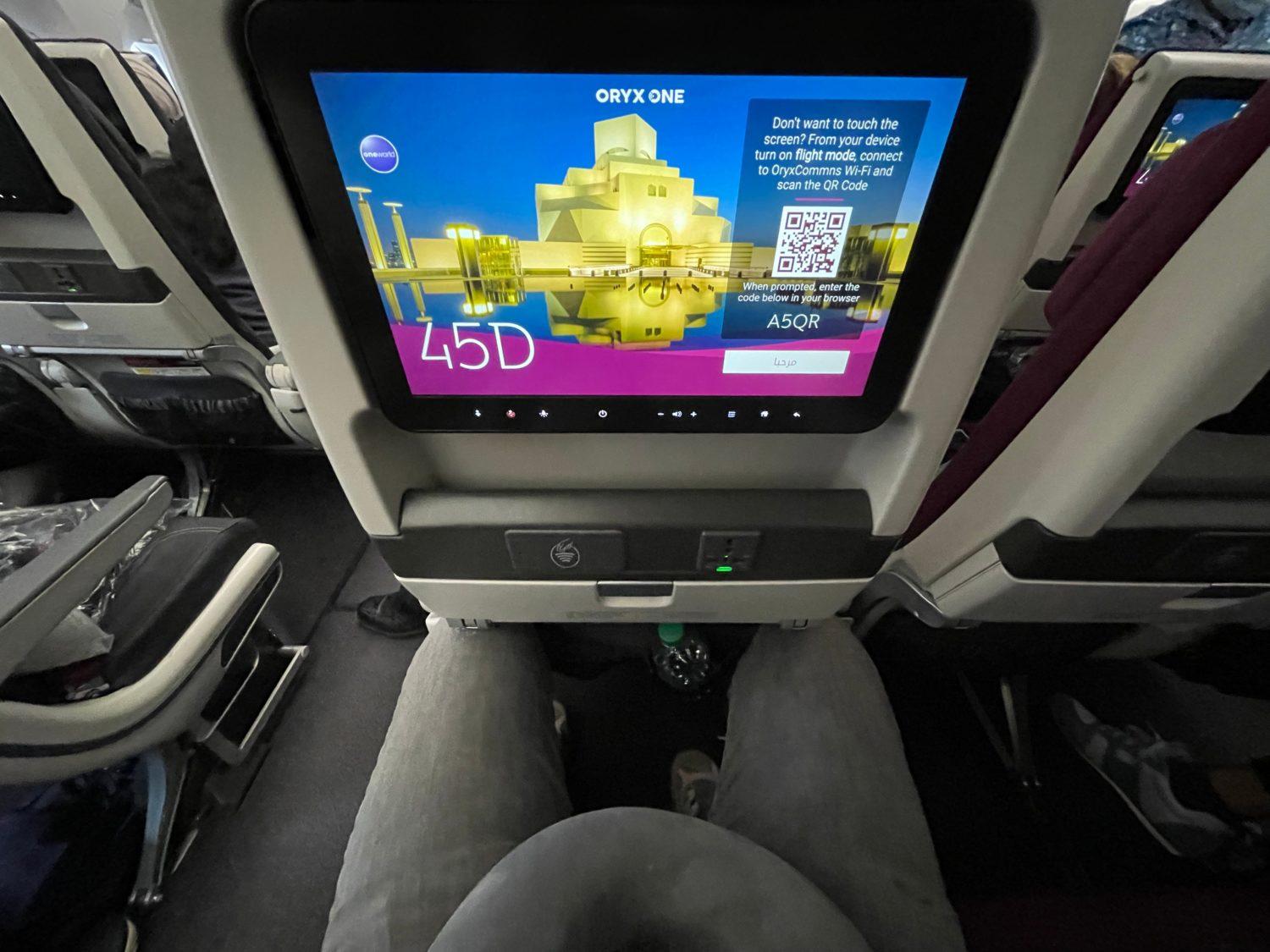 qatar airways economy seat showing the legroom from above