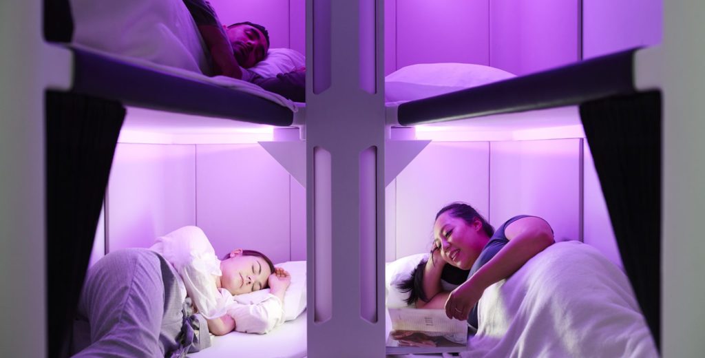 Bunk Beds in the Sky? Air New Zealand Breaks Ground with New 'Skynest' in Economy 10 Skynest with people scaled e1656521019716