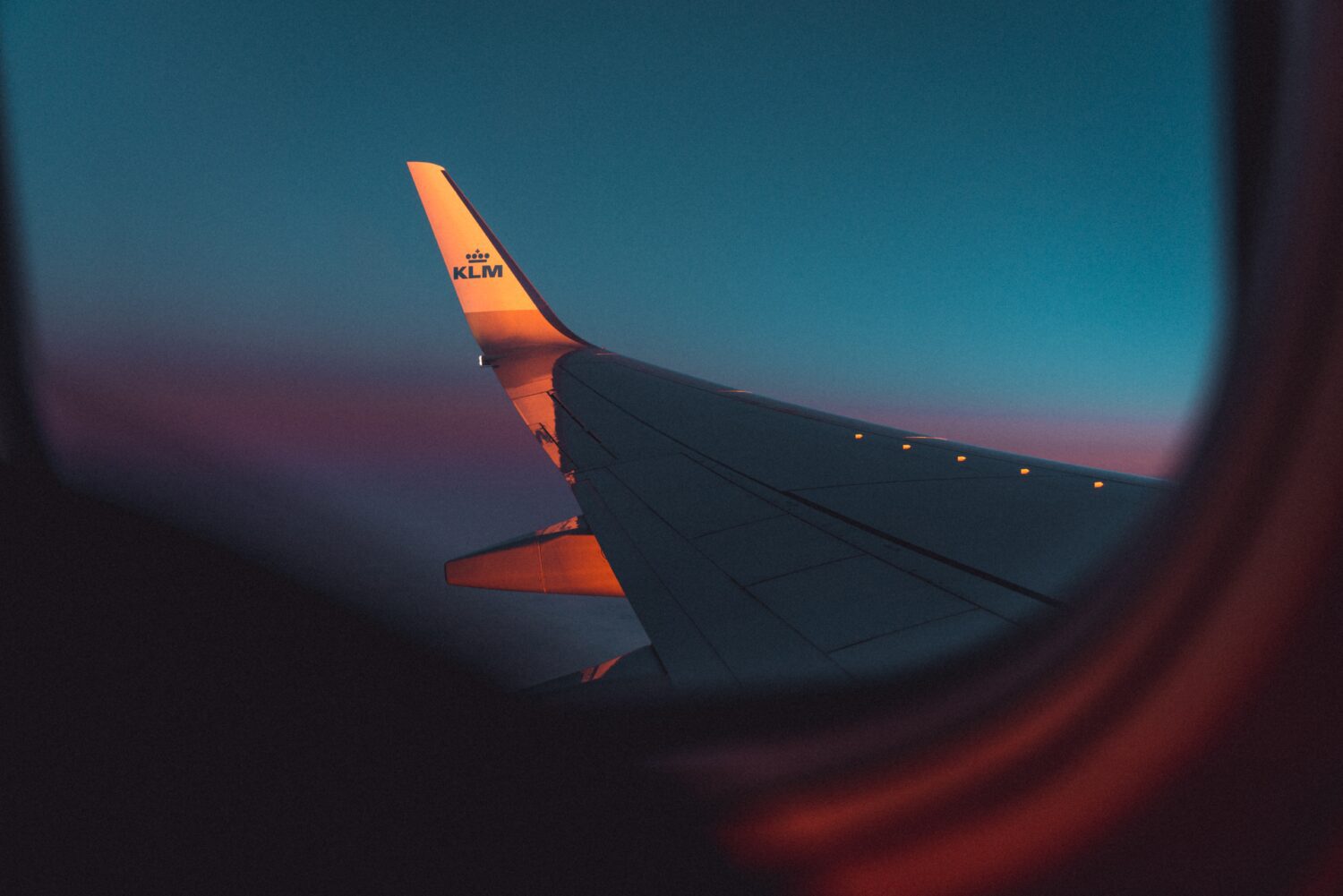 View of KLM airplane wing out the window. 