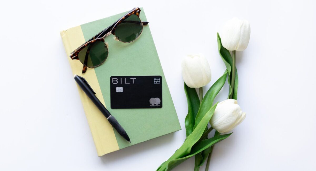 Bilt Rewards Mastercard on a book with flowers