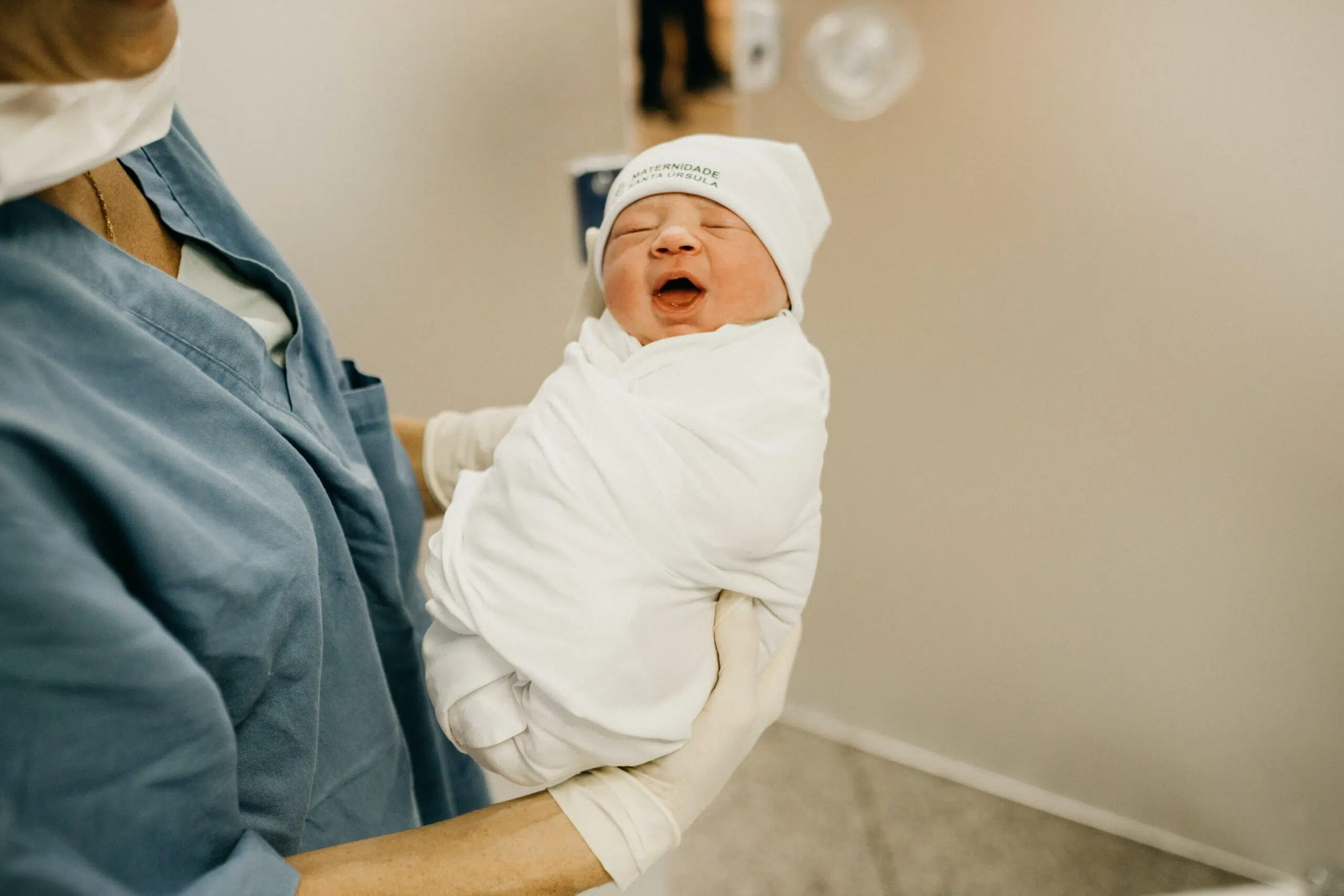 newborn baby being held