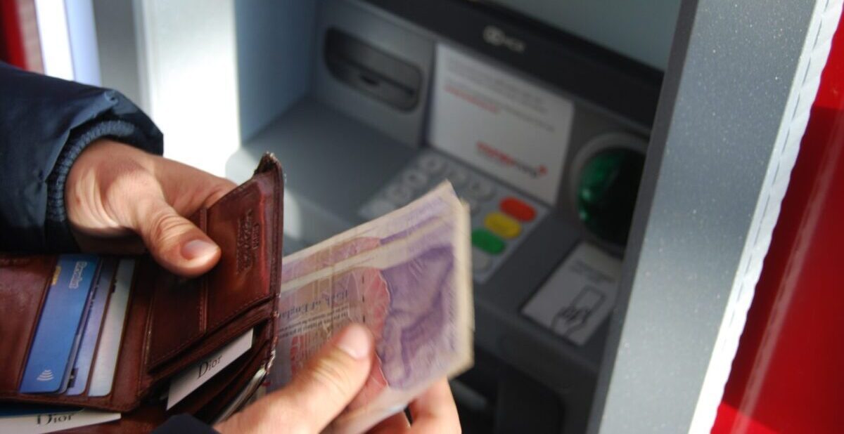 person withdrawing money from an ATM