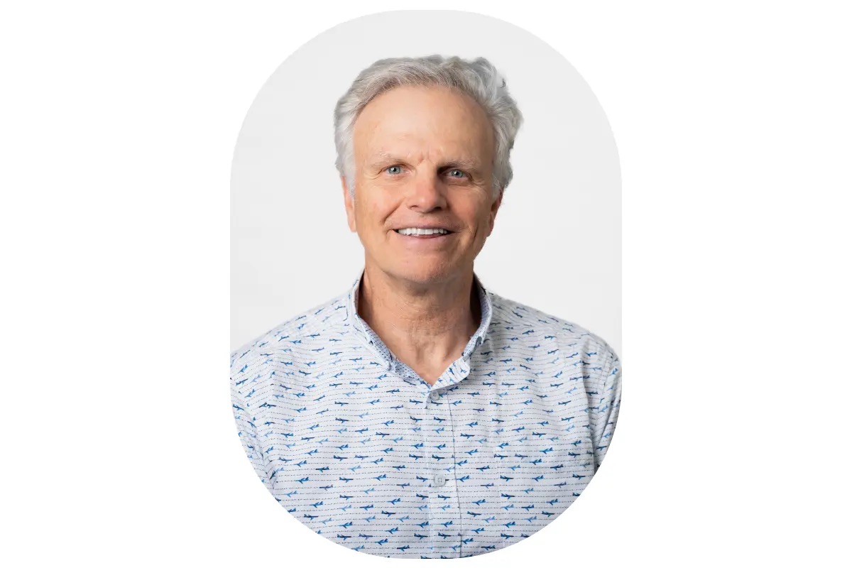 photo of a man in a blue collared shirt