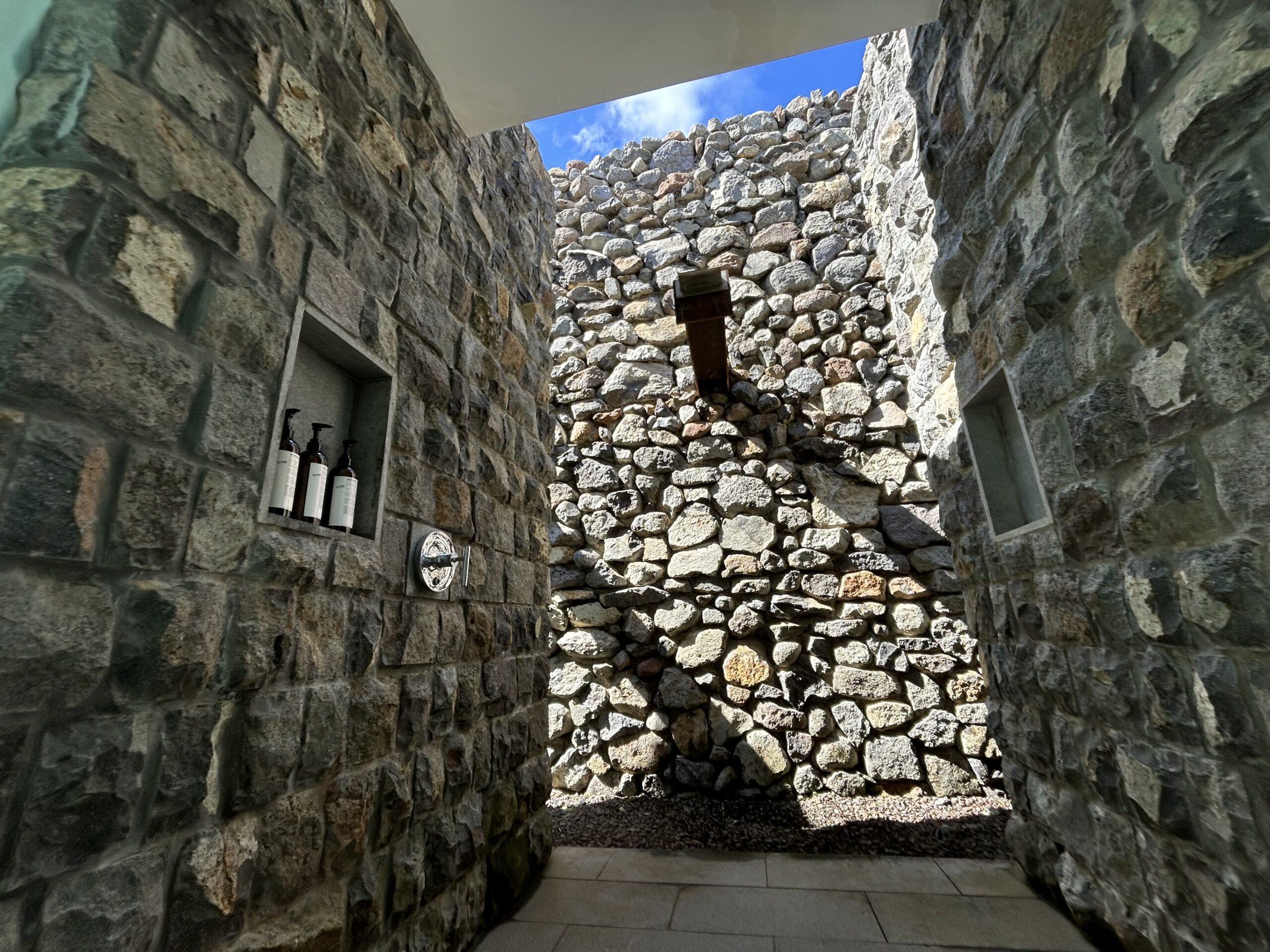 outdoor shower with stone walls