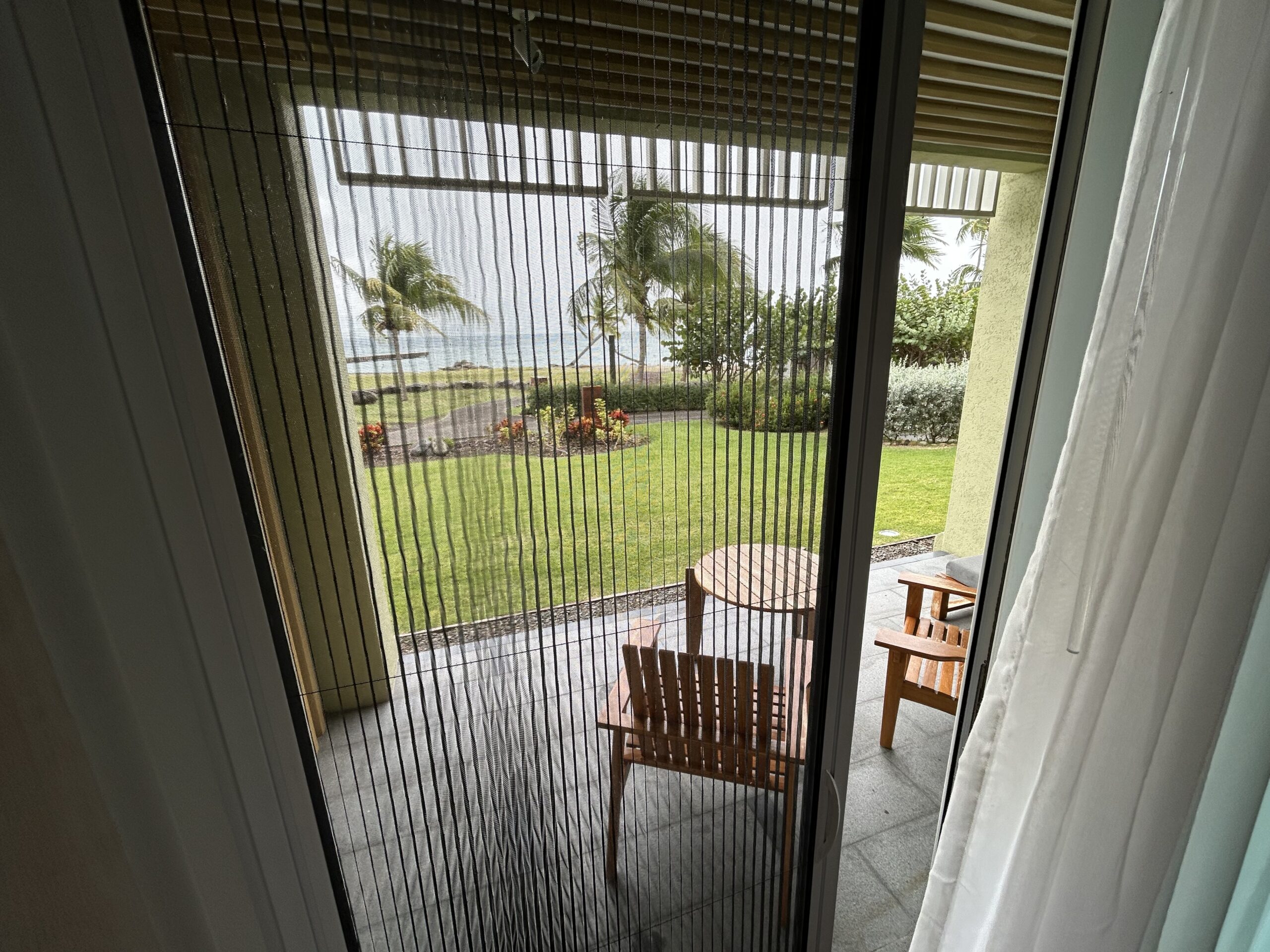 Screen doors on the patio facing the ocean