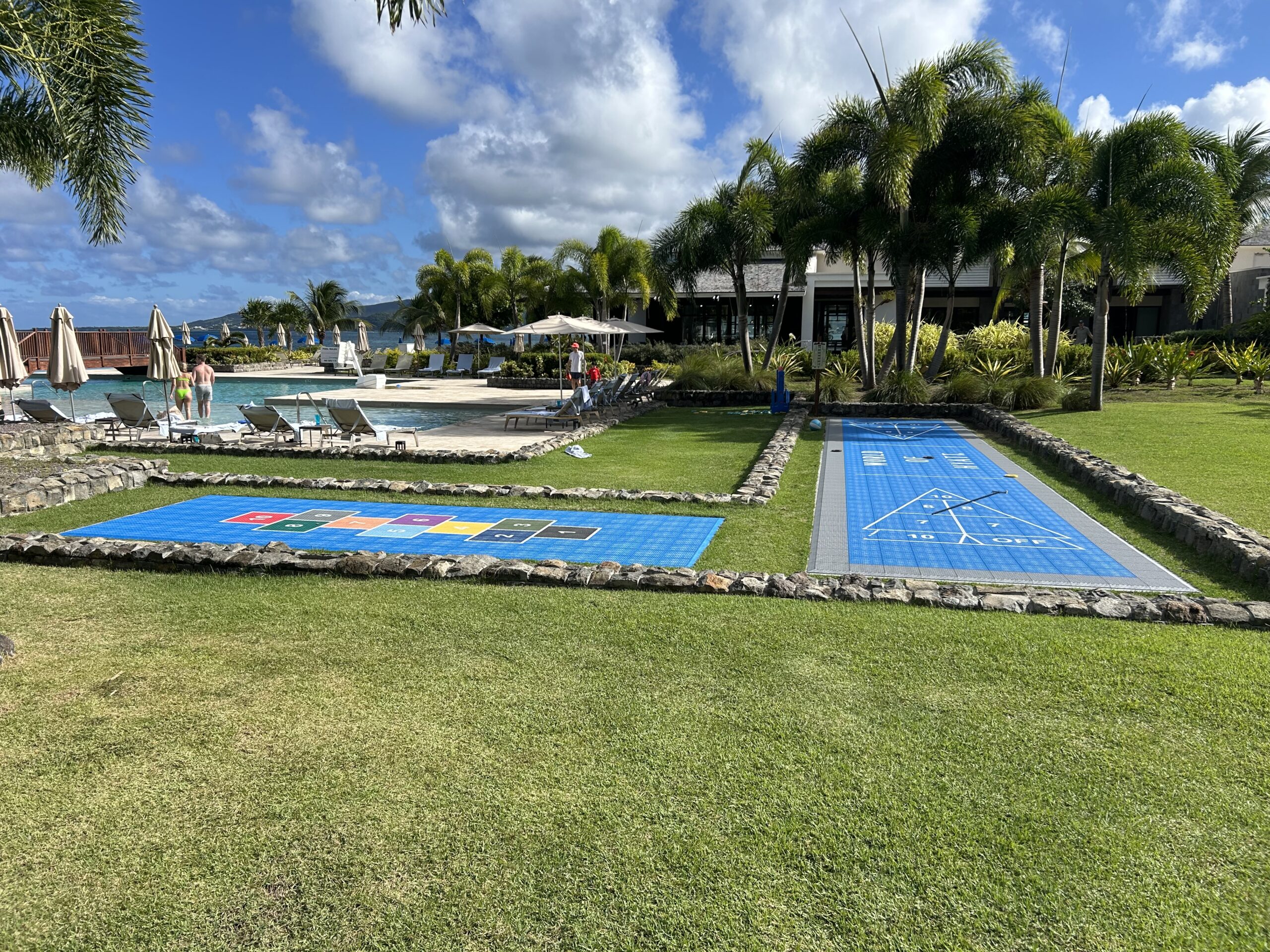 Shuffleboard and hopscotch areas by the pool. 