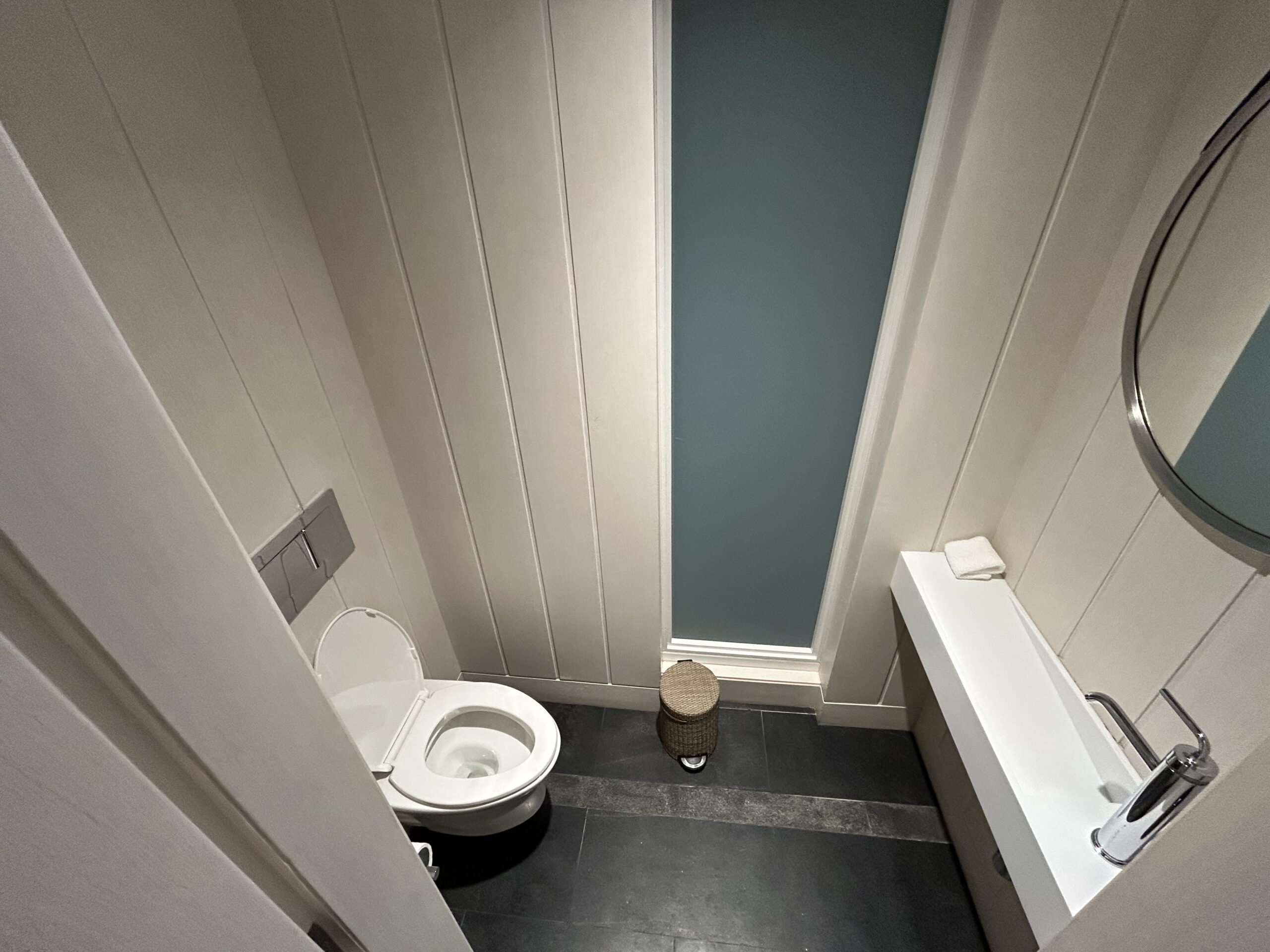 toilet and small sink in a water closet