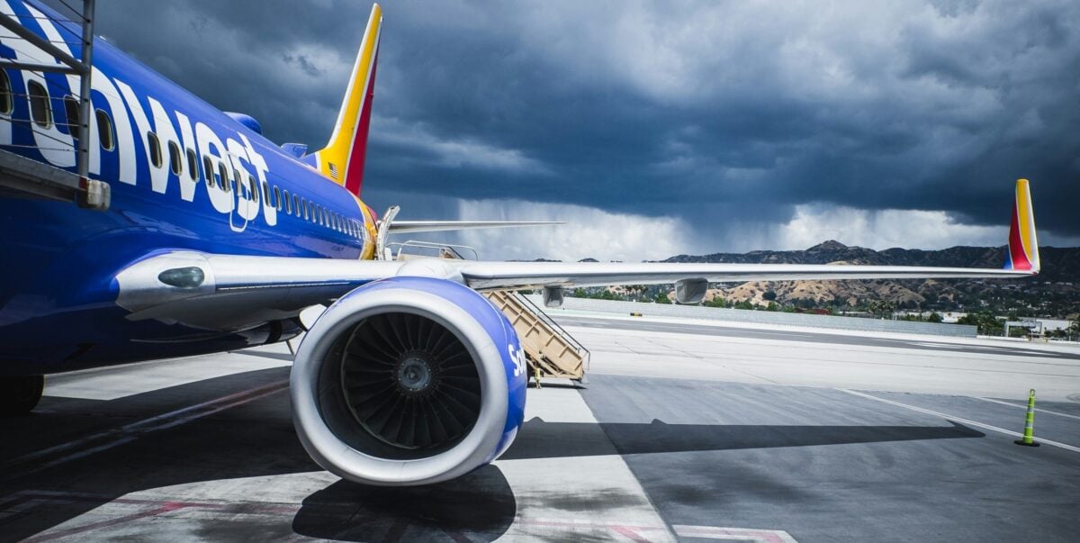 southwest plane on tarmac with storm clouds in background