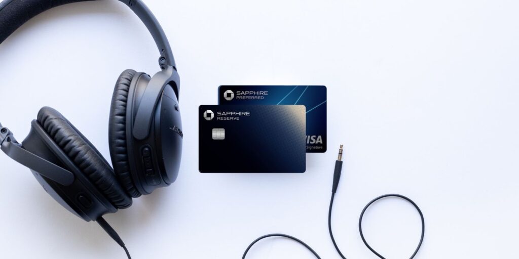 The Best Credit Card Points to Earn in 2026 to Fuel Your Travels 5 Sapphire Reserve and Preferred with a pair of headphones on a white backround.