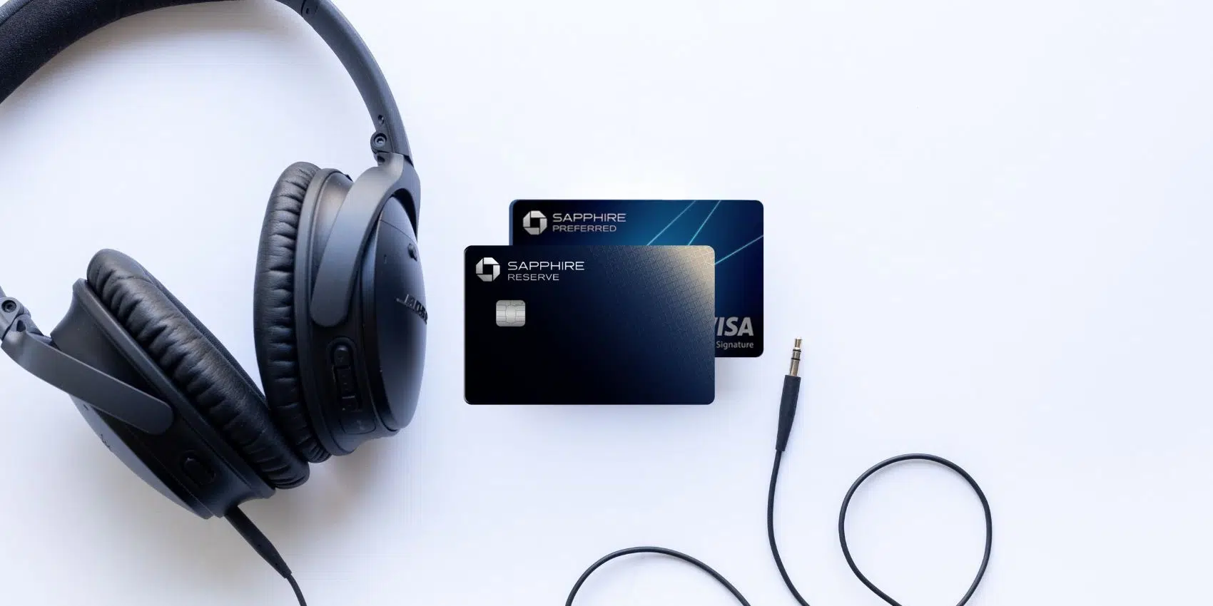 Sapphire Reserve and Preferred with a pair of headphones on a white backround.