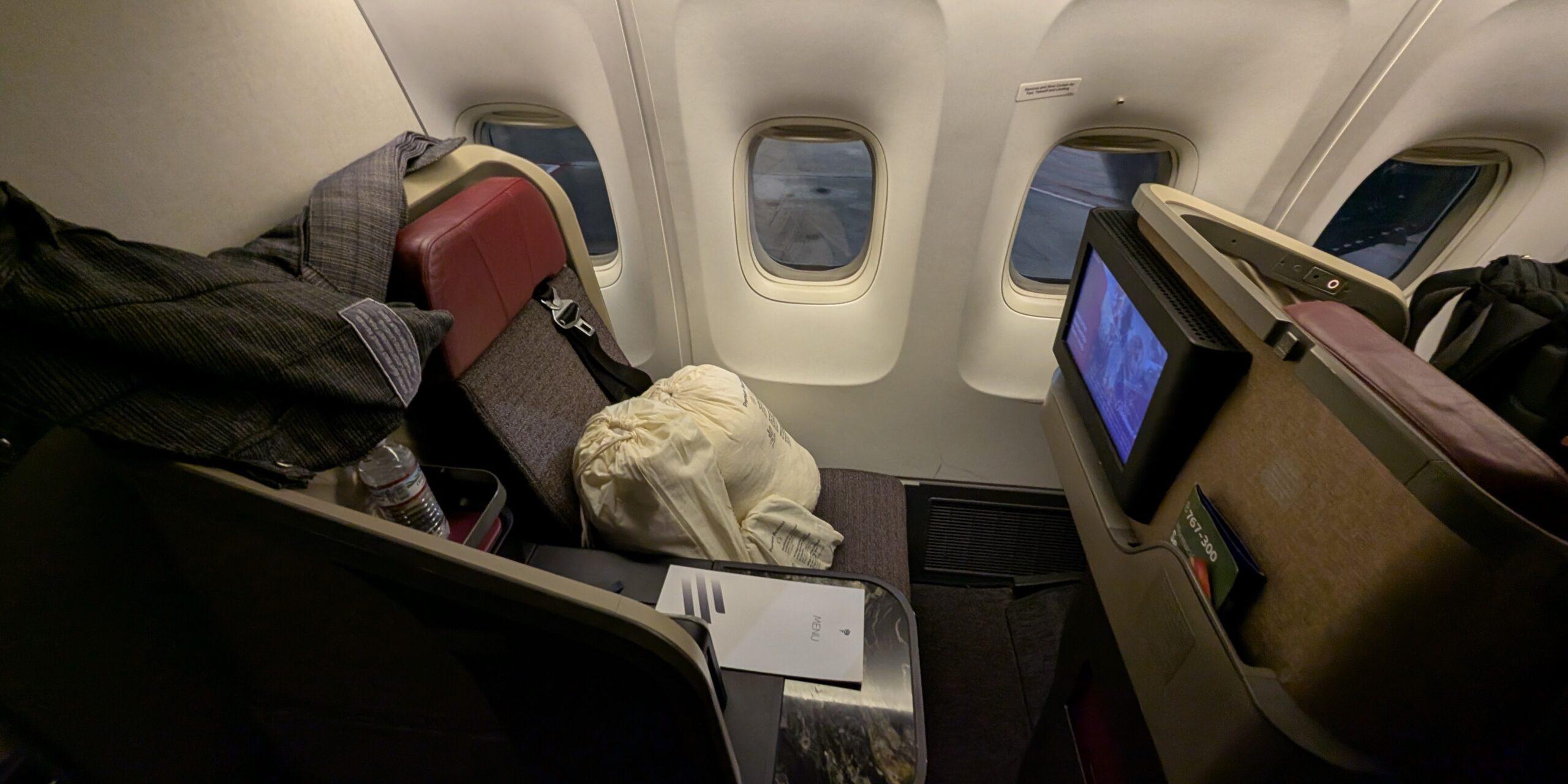 LATAM's Business Class Seat on the Boeing 767-300 with a built-in TV monitor and three windows. 