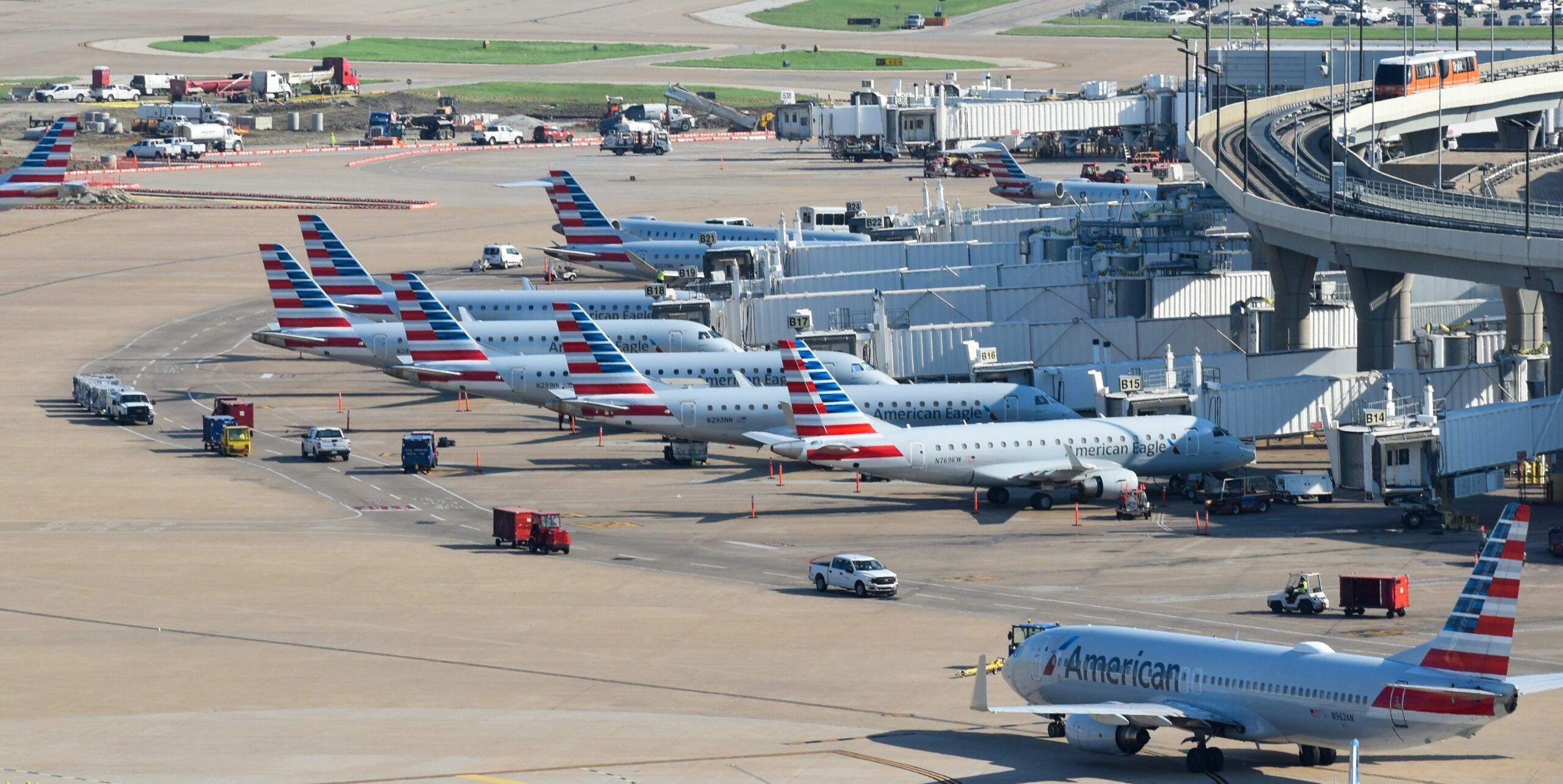 american airlines jets parked at gates in dallas