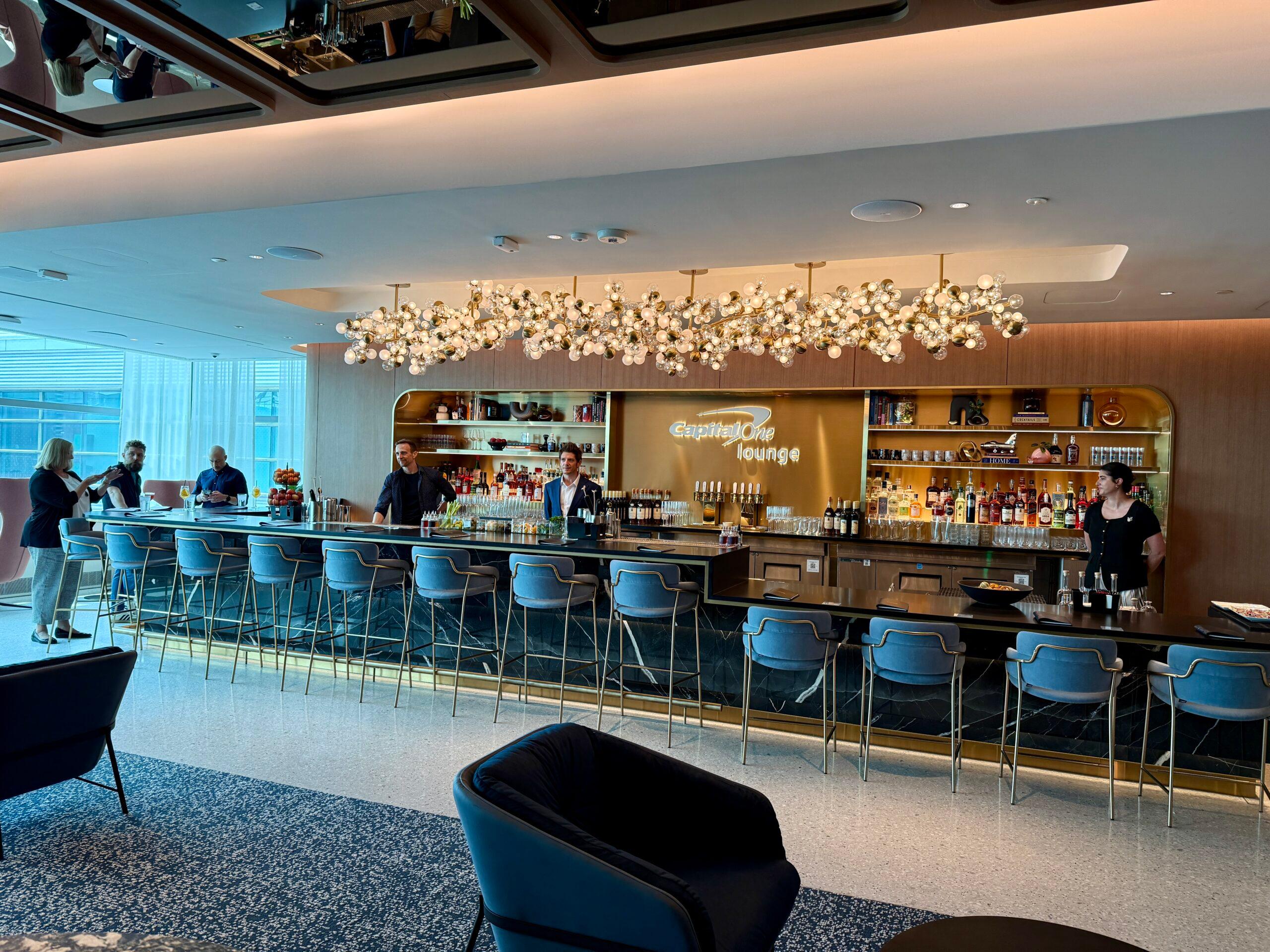 long bar with golden chandelier overhead