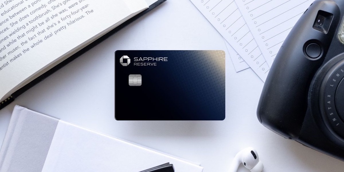 Chase Sapphire Reserve Card with a camera, book, to-do list, glasses, and airpods.