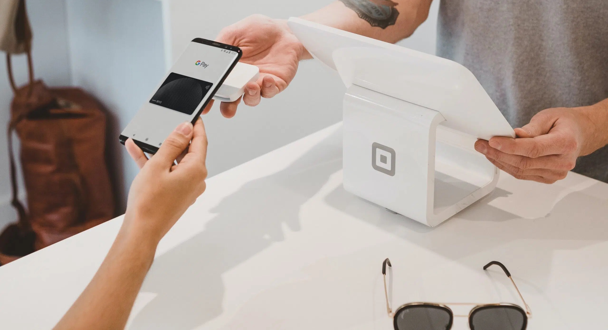 Person using Google Pay for a purchase