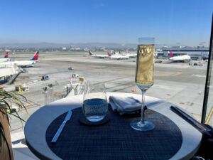 champagne on the patio at the Delta One lounge LAX
