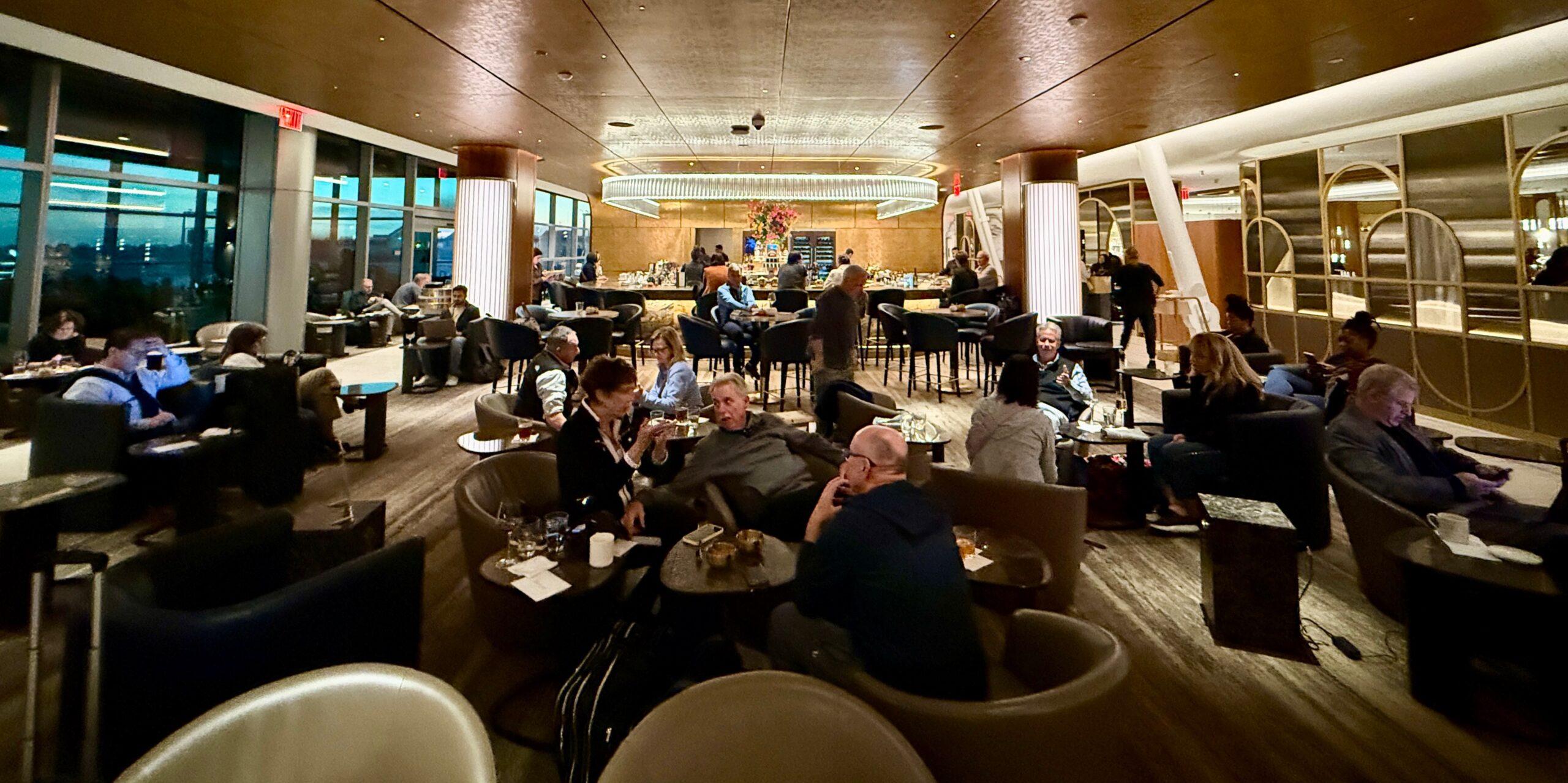 delta one lounge full of passengers