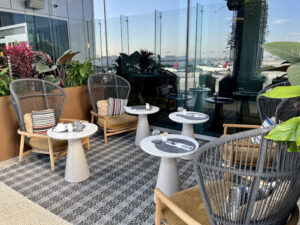 outdoor patio seating Delta One Lounge LAX