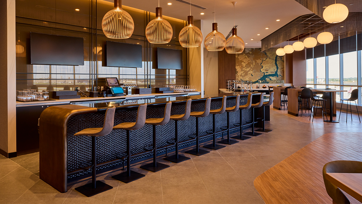 Philadelphia (PHL) Admirals Club Bar with barstools and tables. 