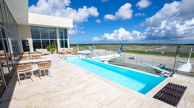 VIP Lounge in Punta Cana (PUJ) with a pool and tarmac views. 