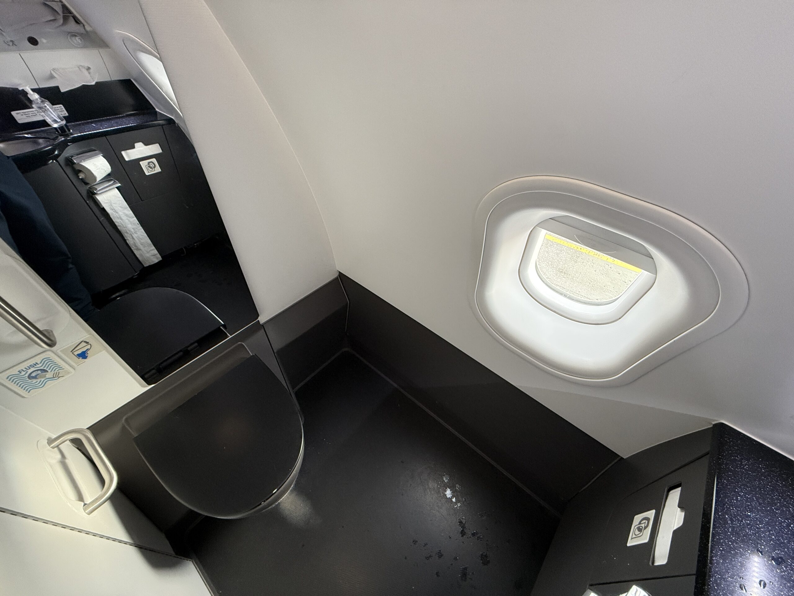 bathroom on a plane with a window
