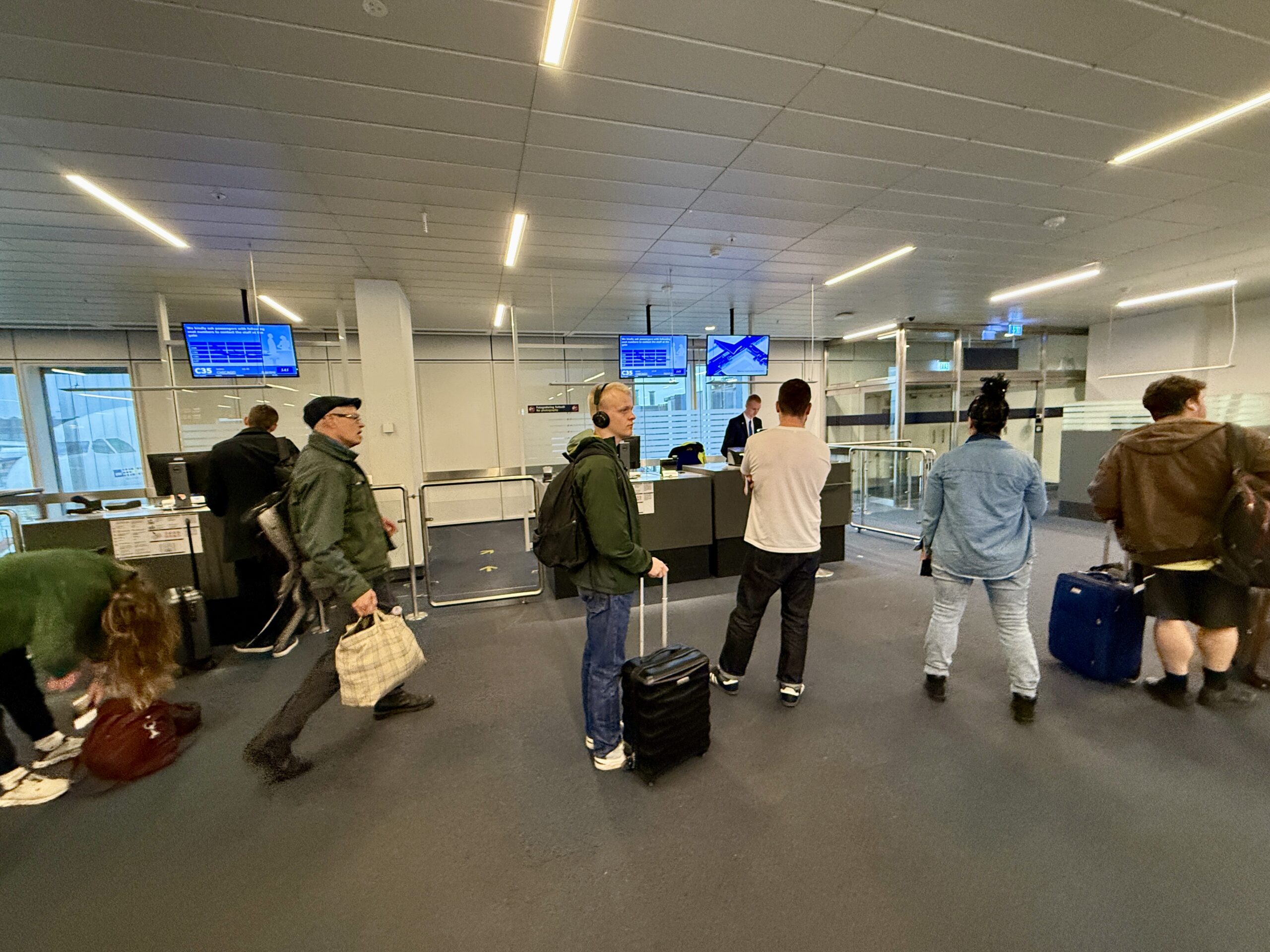 passengers standing at gate