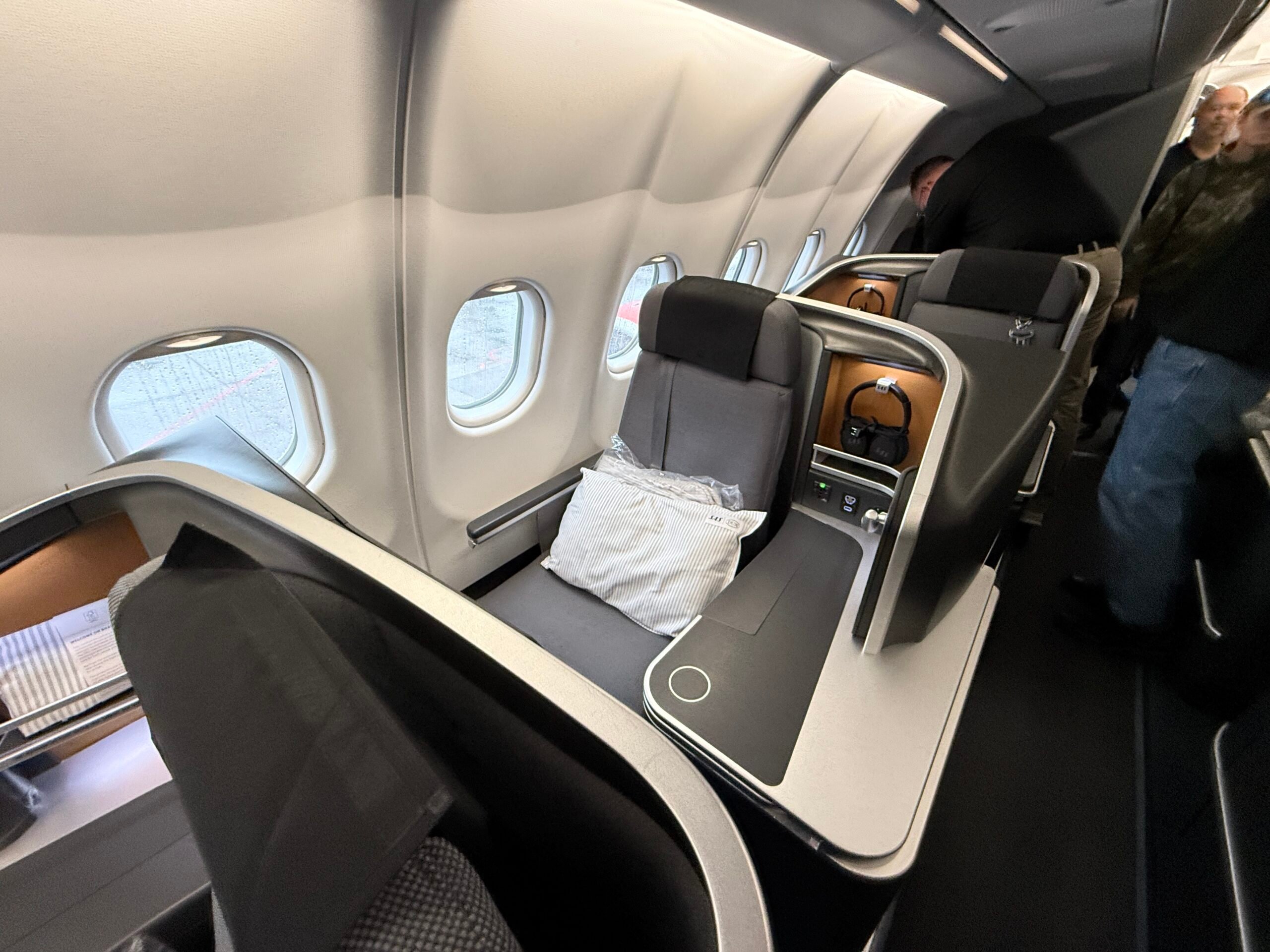 business class seat with pillow on the seat