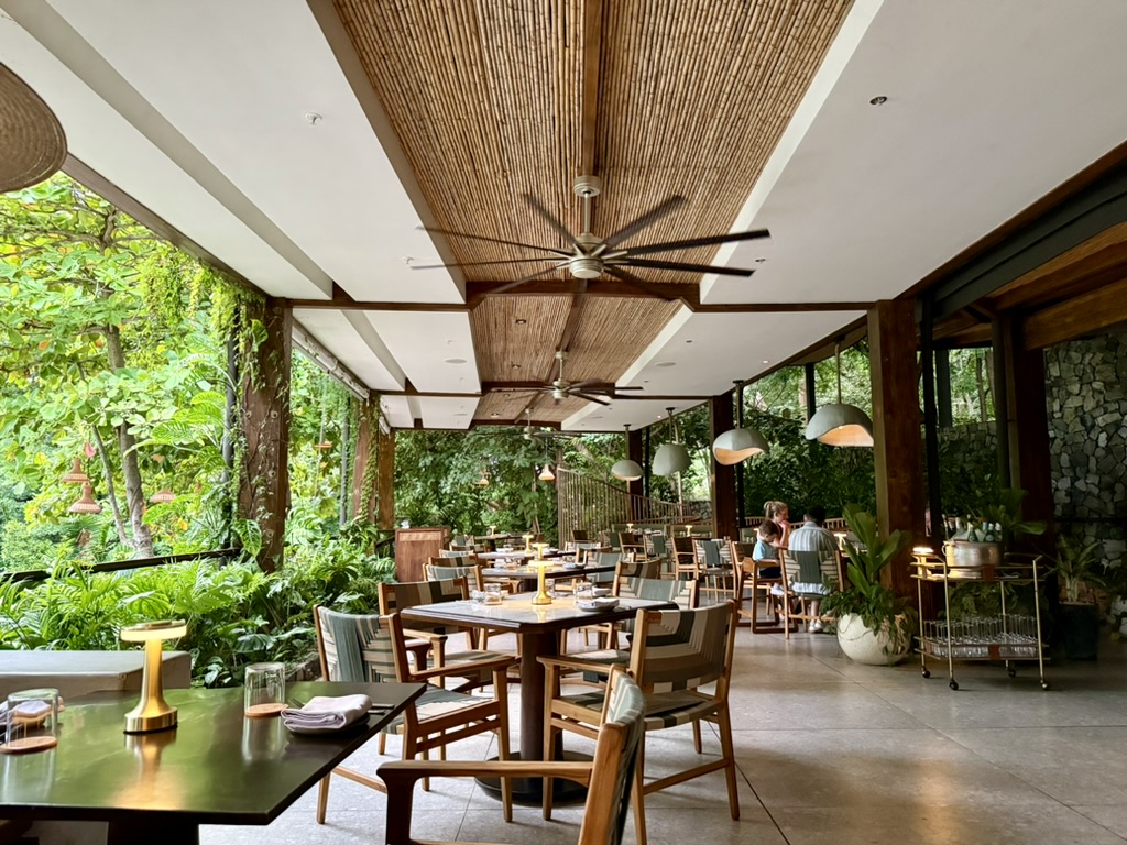 Dining room tables on a covered patio at Ostra.