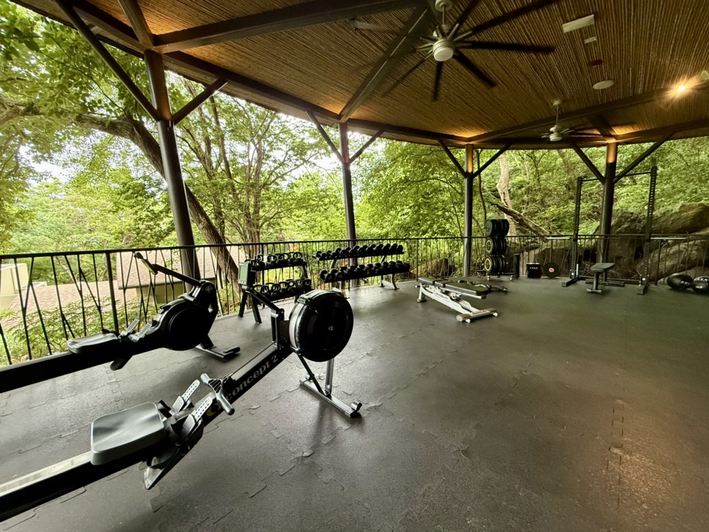 Open air gym space with rowing machines and free weights