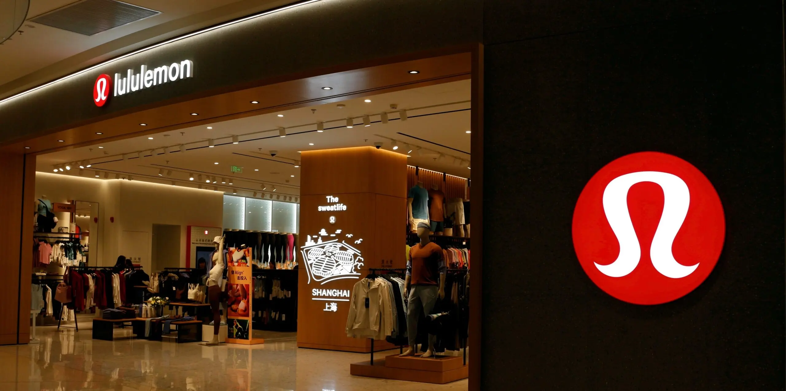 A Lululemon store in a mall with clothing inside