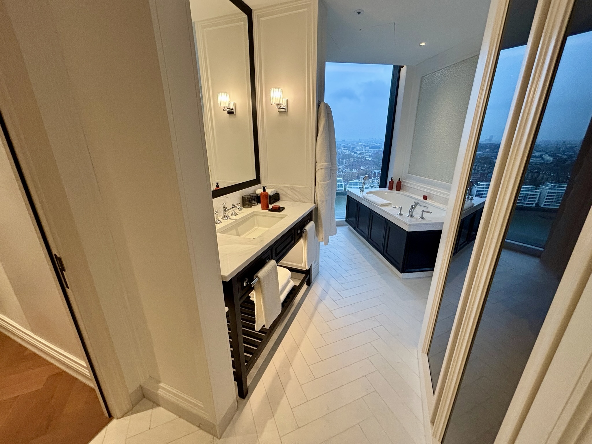 Inside the Park Hyatt London River Thames: Rooms, Dining, Pool & More 16 Main bathroom at Park Hyatt London River Thames with soaking tub, vanity, and floor-to-ceiling windows