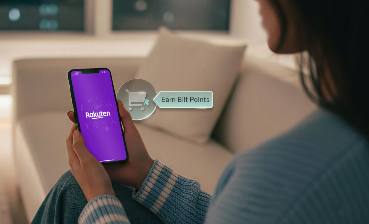 a woman lookinng at her phone with the Rakuten app open and a comment about earning bilt points